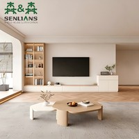 Meuble TV mural crème français avec portes vitrées cintrées, tiroirs à panneaux encastrés, tour de présentation haute et surfaces supérieures en noyer foncé