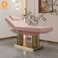 Table faciale de massage électrique pliante rose de luxe avec 4 moteurs et cadre en acier inoxydable