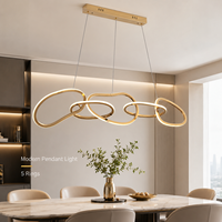 Lustre élégant et luxueux à boucles entrelacées ondulées, anneaux irréguliers dorés polis, suspension LED bicolore pour salon et bureau