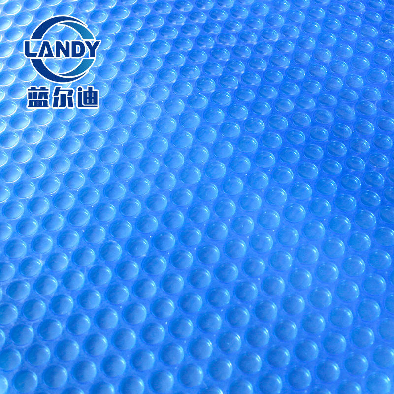 Blue swimming pool thermal cover
