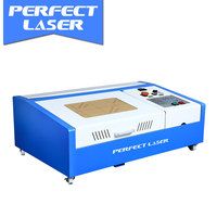 Machine de gravure et de découpe laser CO2 mini Perfect Laser 40w/50w 4040 pour le cuir, le caoutchouc, les tampons, les feuilles, les cadeaux artistiques