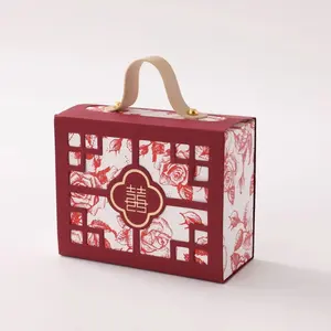 Nuova scatola di caramelle scavata in stile cinese, scatola pieghevole a mano creativa, borsa da matrimonio, scatola regalo di ritorno di sensazioni di fascia alta