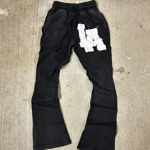 Joggers lisos en blanco personalizados, pantalones de chándal informales con cordón y logotipo de impresión personalizada apilados, pantalones de chándal acampanados, pantalones de hombre