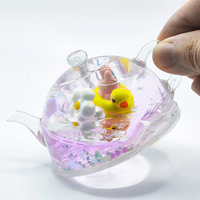 Service OEM personnalisé : Figurine théière en acrylique transparente à liquide flottant et à mouvement, avec paillettes