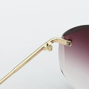 Lunettes de soleil rondes sans monture, style moderne, métalliques, anti-UV, pour femmes, idéales pour les voyages et la plage. - Product Image 4