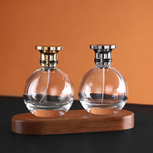 Flacon pulvérisateur de parfum en verre rond transparent haut de gamme de 100 ml, rechargeable, avec bouchon en alliage de zinc doré ou argenté - Product Image 3