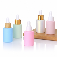 Vente en gros de flacons compte-gouttes mats roses de 30 ml (1 oz) pour huiles essentielles et cosmétiques, emballage de luxe vide pour sérum avec boîte personnalisée