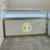 Vitrine à bijoux en verre trempé sur mesure avec éclairage LED chaud et système de verrouillage de sécurité pour magasins de détail et centres commerciaux