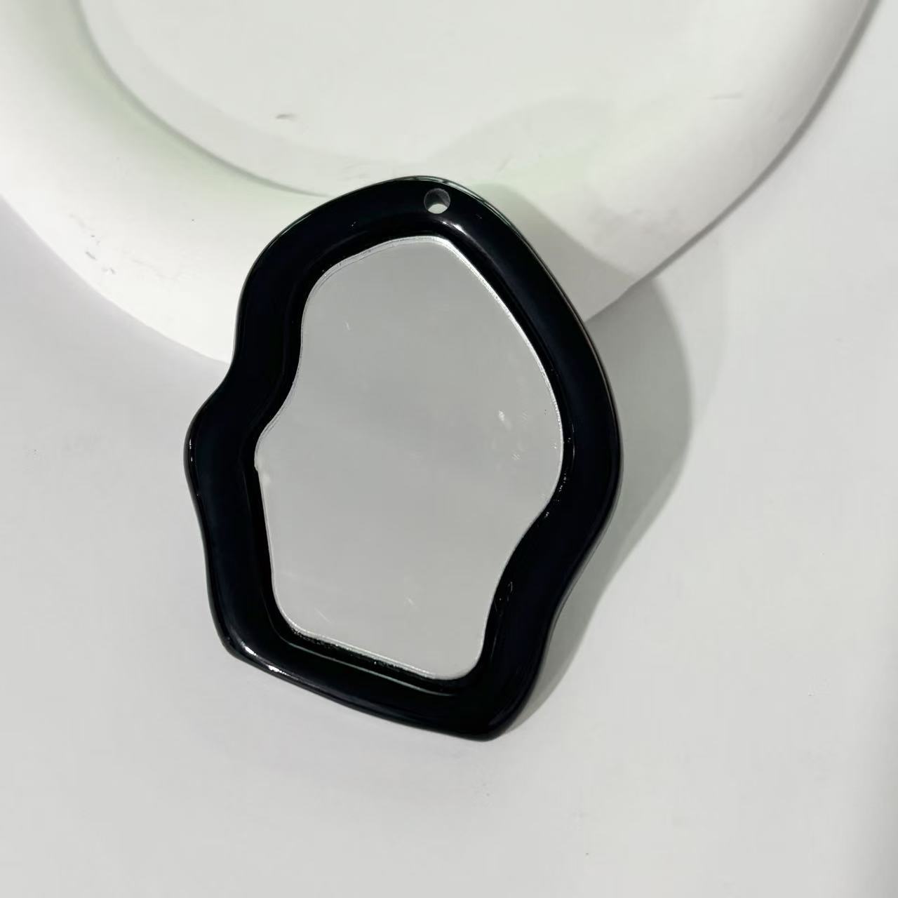 Irregular small mirror-black