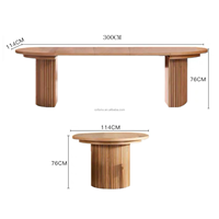 Table transformable de 114 cm de diamètre, extensible jusqu'à 300 cm, offrant un espace repas confortable pour 4 à 14 personnes