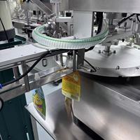 Machine de remplissage et de scellage automatique Zhongjie pour sachets à bec verseur (doypacks) pour l'emballage de liquides, sauces, beurre et pâtes (Ketchup, etc.)