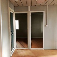 Maison conteneur préfabriquée extensible de luxe avec 2 chambres aux normes australiennes avec panneau sandwich pliable en acier pour cuisine