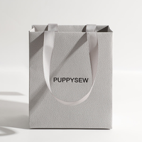 Sacs en papier d'art de luxe personnalisés pour vêtements, bijoux et artisanat utilisés dans des emballages de luxe à texture épaisse avec logo personnalisé