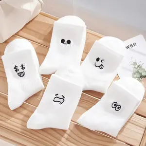 Hot selling custom girls white cartoon embroidery smile face cotton socks mid tube cute fashion crew socks for women