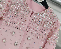 Ensemble 2 pièces élégant pour femme 2026 : Manteau à col rond et manches longues orné de perles, et robe longue sans manches coupe trapèze
