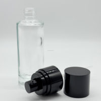 Paquet de maquillage vide bouteille de lotion de soin de la peau bouteille de pompe noire en verre rond de cylindre de 50ml pour les soins de la peau