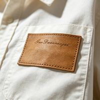 Étiquettes personnalisées en cuir microfibre écologique avec logo thermocollé pour jeans, vêtements, accessoires de confection à coudre, vente en gros OEM