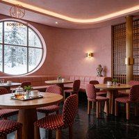 Ensemble de mobilier moderne pour café, restaurant, hôtel, cafétéria : banquette en cuir orange clair, chaise en tissu à pois, table en bois