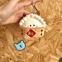 Meilleure vente en gros : Porte-clés créatif en peluche super douce en coton PP, en forme de boulette, avec doublure en maille, cadeau anti-stress Geely