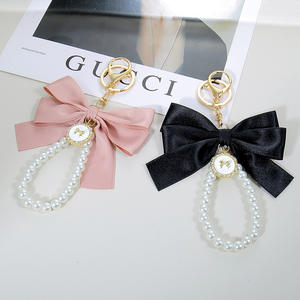 INS nouveau Style inspiré perle arc porte-clés sac <span class=keywords><strong>pendentif</strong></span> téléphone portable accessoires dragonne téléphone lanière téléphone en gros - Product Image 4