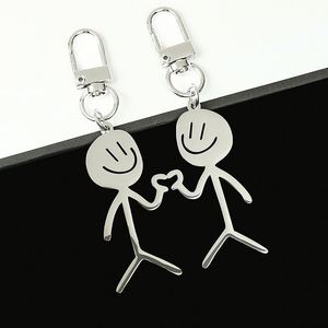 Porte-clés mignon en acier inoxydable en forme de couple avec dessin simple pour visage, pendentif mousqueton en forme de personnage - Product Image 2