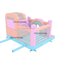 Château gonflable commercial extérieur arc-en-ciel avec toboggan pour enfants et tout-petits, idéal pour la location de fêtes, avec souffleur inclus