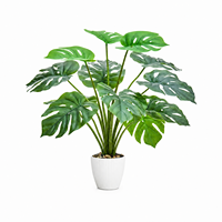 Monstera artificiel en pot avec feuilles blanches pour la décoration intérieure, du bureau et du bureau à domicile
