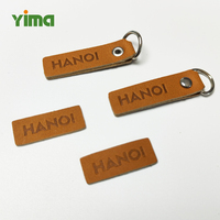 Étiquettes de vêtements en métal écologiques de forme personnalisée, service OEM en gros, logo métallique personnalisé, cuir PU, daim, silicone
