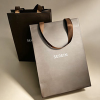 Sac fourre-tout de luxe personnalisé en papier kraft avec logo en feuille d'argent, poignée Flexiloop en papier couché recyclé pour emballage de bijoux et vêtements