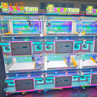 Machine à griffes à monnayeur pour quatre joueurs, jeu d'arcade attrape-poupées, excellent rapport qualité-prix pour centres commerciaux et salles de jeux