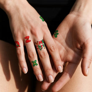 สติกเกอร์รอย<span class=keywords><strong>สัก</strong></span>ลายคริสต์มาสแต่งหน้าสีสันสดใสแบบชั่วคราวกันน้ำตกแต่งคริสต์มาสตัวอักษรสักเหมาะสำหรับหน้าแขน - Product Image 1