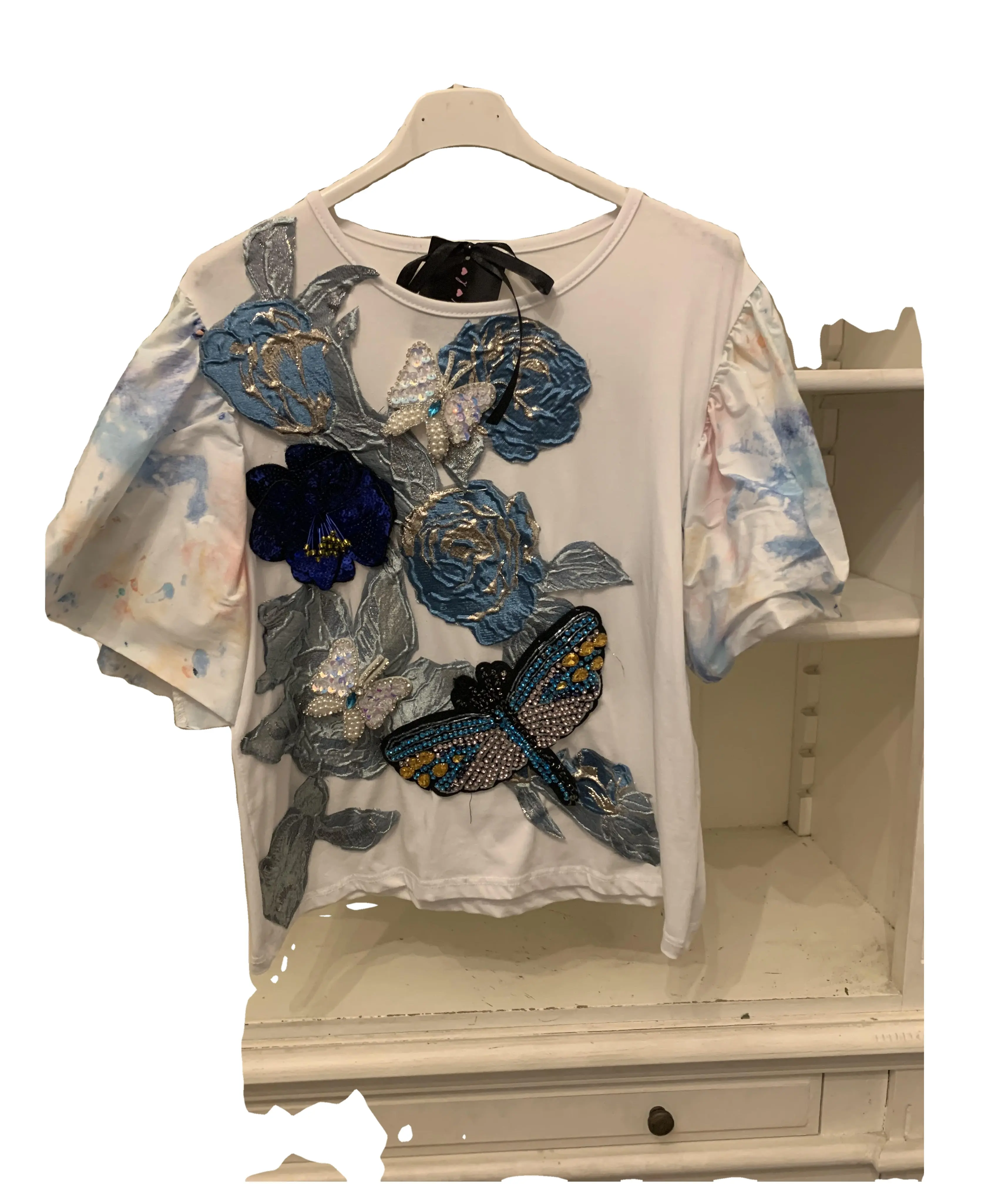 women's t-shirt made in italy with printed sleeves and puffy fabric creating puff sleeves the base is embroidered with floral mo