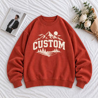 Sweat-shirt à col rond rouge rouille en gros avec imprimé graphique paysage montagneux personnalisé, vêtement décontracté à manches longues pour les détaillants de vêtements
