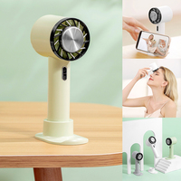 MIni ventilador de escritorio portátil de diseño Turbo, productos de verano, refrigeración de Semiconductor con soporte para teléfono móvil