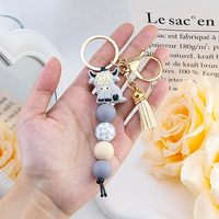 Porte-clés animaux mignons : Vache des Highlands, Éléphant, Vache laitière – Pendentif à pompon pour sac à dos
