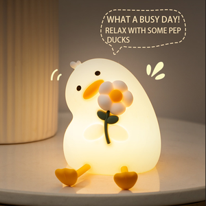 ไฟกลางคืนรูปเป็ดดอกไม้สีสันสดใส LED แบบนุ่มนิ่ม ชาร์จไฟได้ ควบคุมด้วยการสัมผัส แสงสีขาวอบอุ่น ปรับความสว่างได้ ผลิตจากซิลิโคนเกรดอาหาร สำหรับเด็กเล็ก เด็กทารก และเด็กโต - Product Image 1