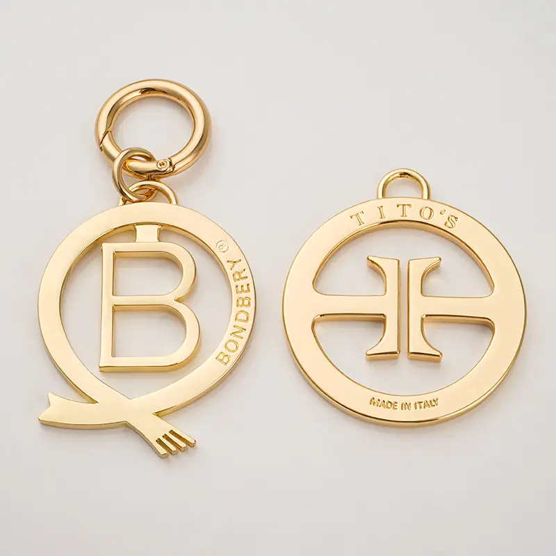 Personalized Design Luxury Bag Charms Engraved Hollow Logo Hang Handbag Metal Tags Gold Plated Round Metal Key Ring for Bag