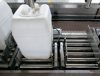 Machine de remplissage automatique de fûts à 4 têtes pour huile lubrifiante, avec pesage par gravité et bouchage