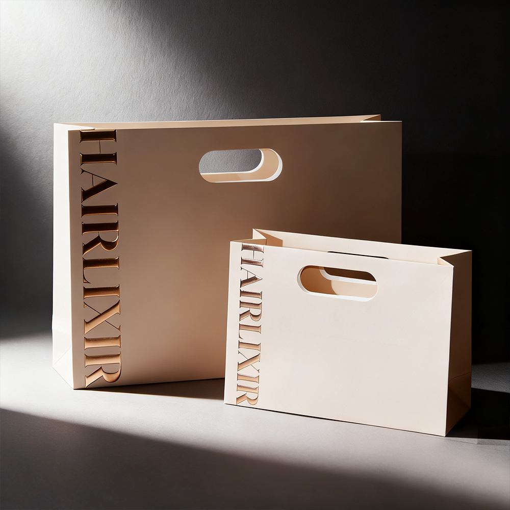 Hot-selling Luxury Embossed Logo Fashion Die-Cut Handles Shopping Paper Bags Die Cut Handle Make Up Paper Bags