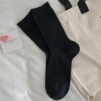 Chaussettes mi-mollet pour femmes en couleur bonbon, polyvalentes pour l'automne et l'hiver, chaussettes longues tendance à rayures verticales de couleur unie