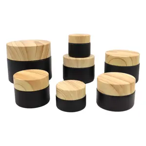 Özel mat buzlu siyah 50g 30g 15g 10g 5g 10ml 20ml 50ml cam bambu ahşap tahıl kapaklı krem kavanozu pot konteynerler