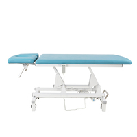 Lit de traction électrique au design moderne pour la physiothérapie et la chiropratique hospitalières Lit à roulettes en métal
