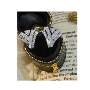 Pendientes de Oro Puro de 18k Xinfly con Diamantes Naturales de 0.68ct en Forma de Baguette, Redondos y en Forma de V - Product Image 1
