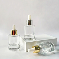 Bouteille de sérum cosmétique personnalisée de 30ml flacon compte-gouttes en verre rose d'huile essentielle 1oz emballage de soins de la peau de forme ovale cylindrique