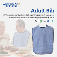 Tablier adulte sans manches à la mode pour femmes vente en gros protecteur de vêtements imperméables réutilisables bavoir lavable avec motif imprimé