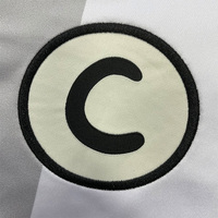 Maillots de football personnalisés coupe oversize et courte, avec broderie, logo en patch tissé et impression de passepoil, style streetwear