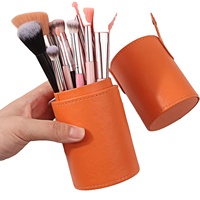 Vente en gros de porte-pinceaux de maquillage en forme de tube rond en cuir PU avec logo personnalisé, coque rigide, portable, pour les voyages