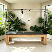 Reformers de Pilates en chêne pour la rééducation, Cadillac de Pilates avec cadre trapèze pour usage en clinique de physiothérapie