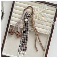 Nouveau porte-clés en alliage de zinc motif Maillard avec nœud perlé et ruban en dentelle pour breloque de sac pour filles
