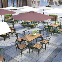Ensemble table et chaises modernes en fer et WPC pour 4 personnes, idéal pour les marchés nocturnes, les stands de restauration et les repas décontractés en extérieur.